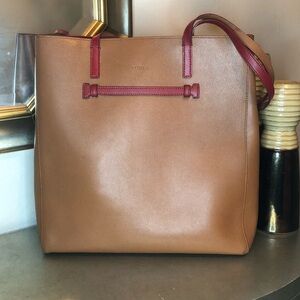 Furla large taupe tote with burgundy trim.